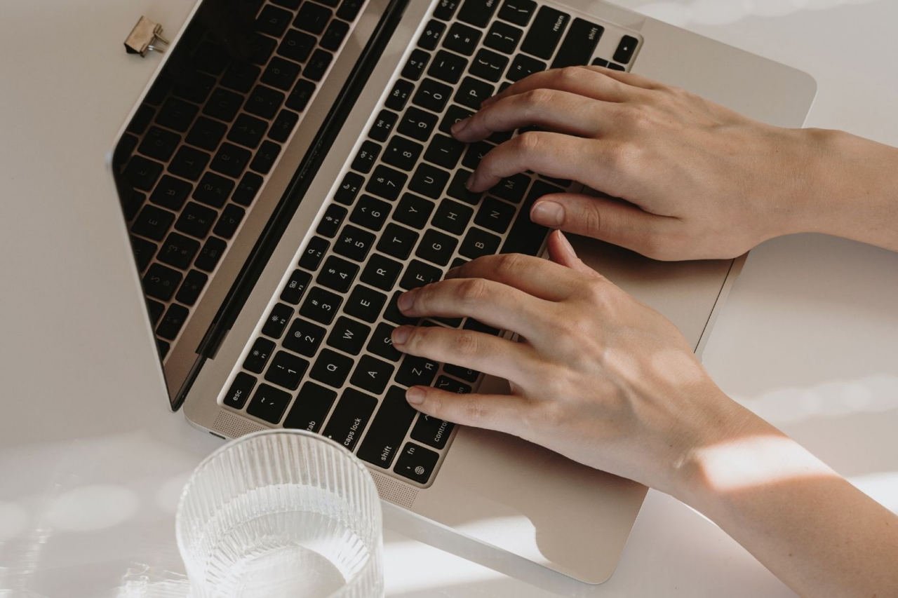 Person typing on laptop